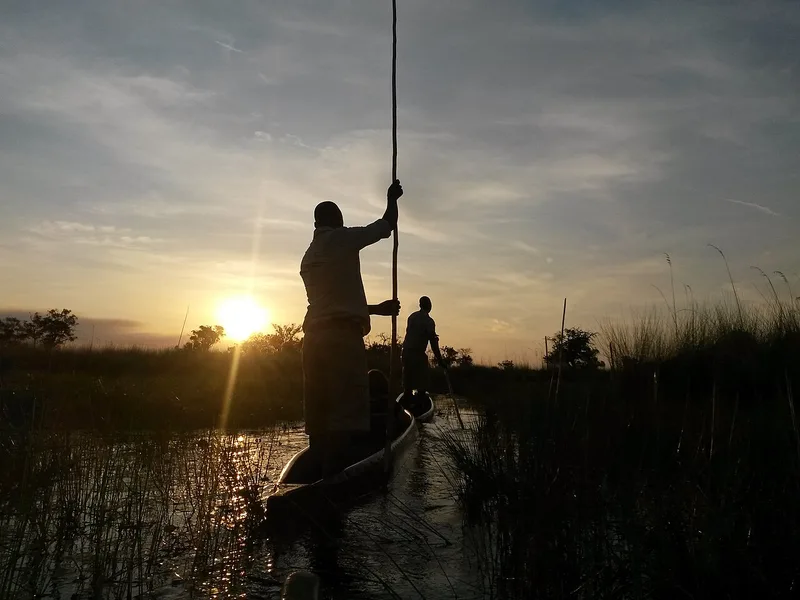 Mokoros heading home at sunset — the last hour of a full-day trip